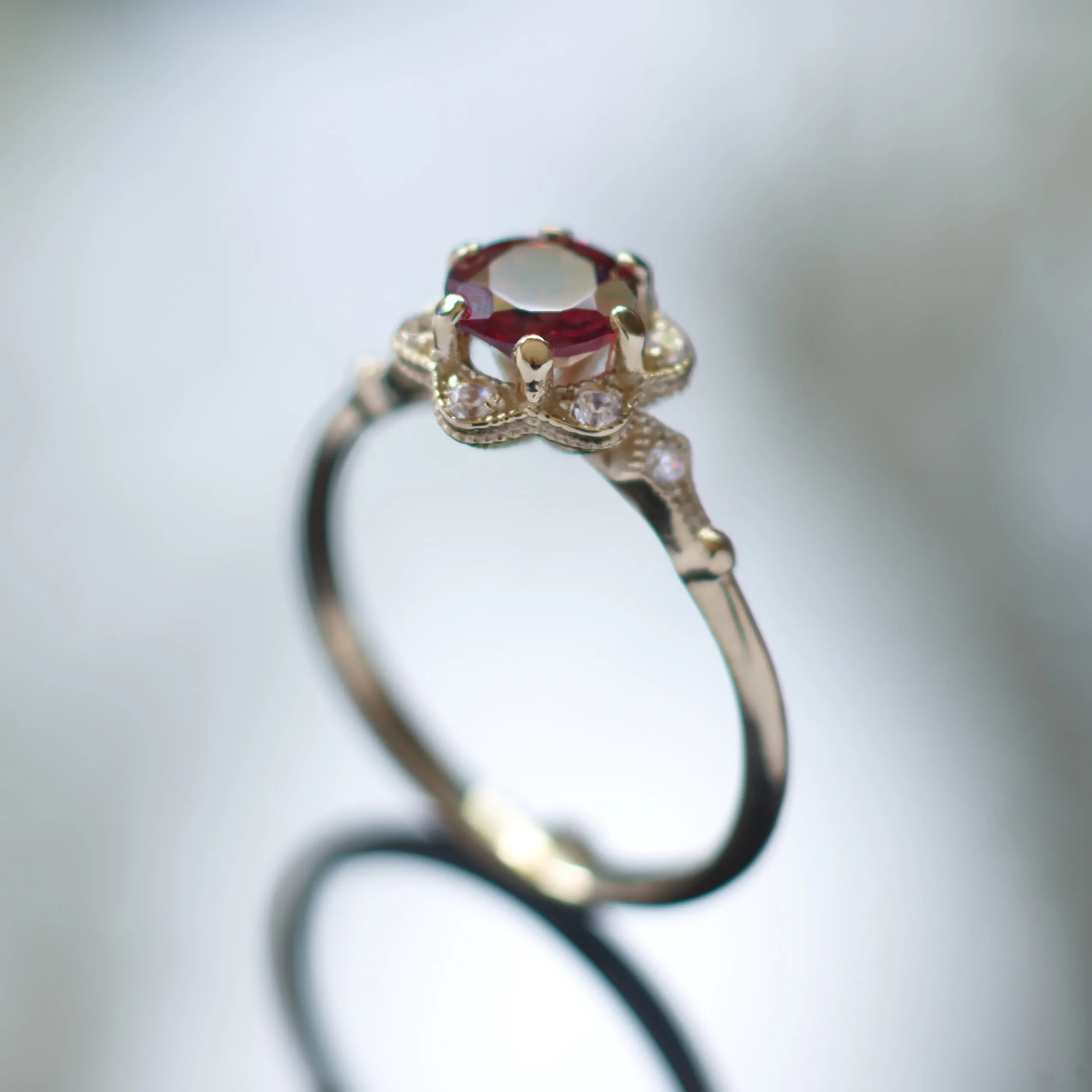 RG1854 Gold flower ring with Garnet and CZ